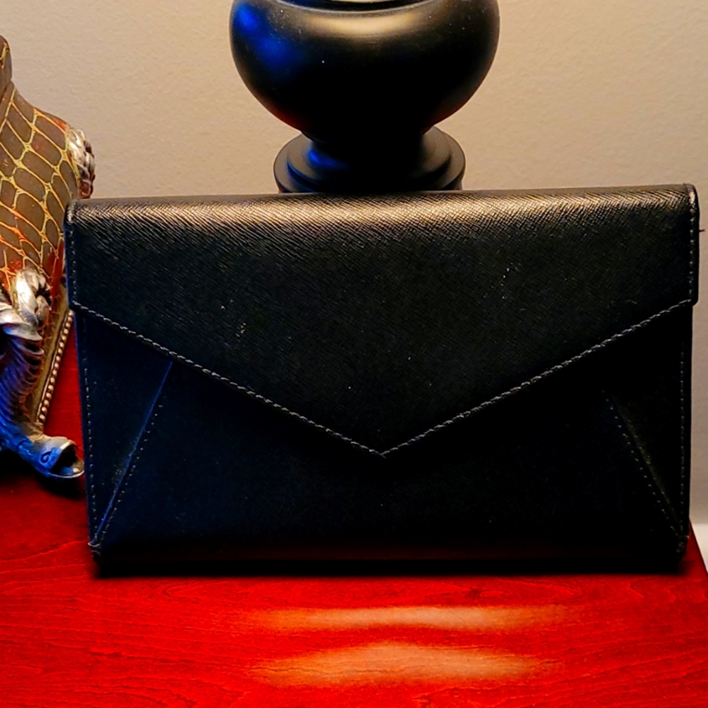 Neiman Marcus black leather wallet, includes an insert for credit cards